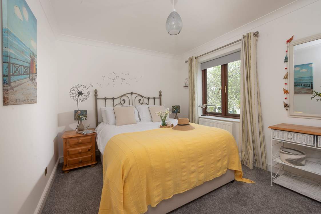 The principal bedroom has a comfy king-size bed.