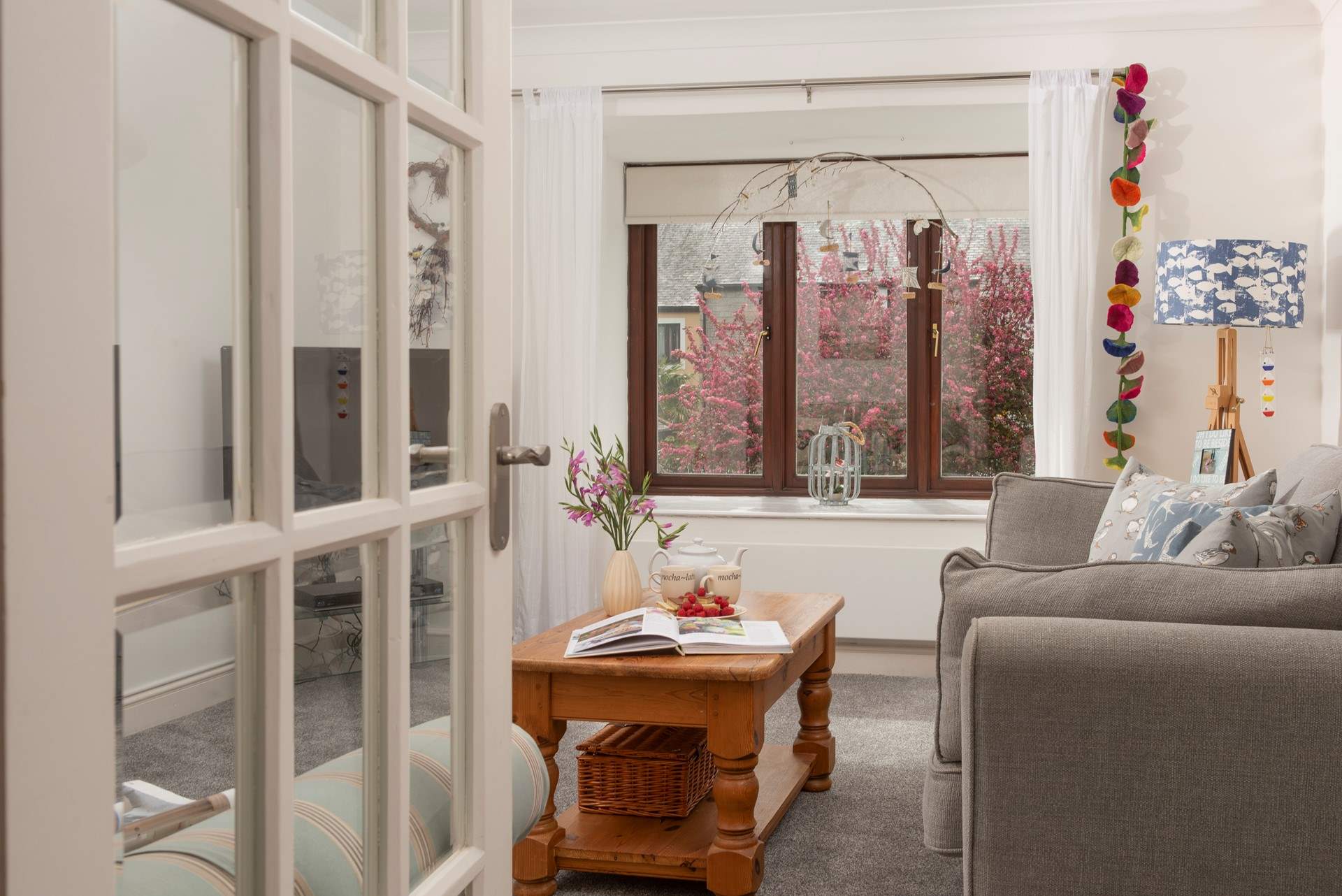 Looking through to the sitting-room which overlooks the pretty communal gardens. 