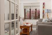 Looking through to the sitting-room which overlooks the pretty communal gardens.