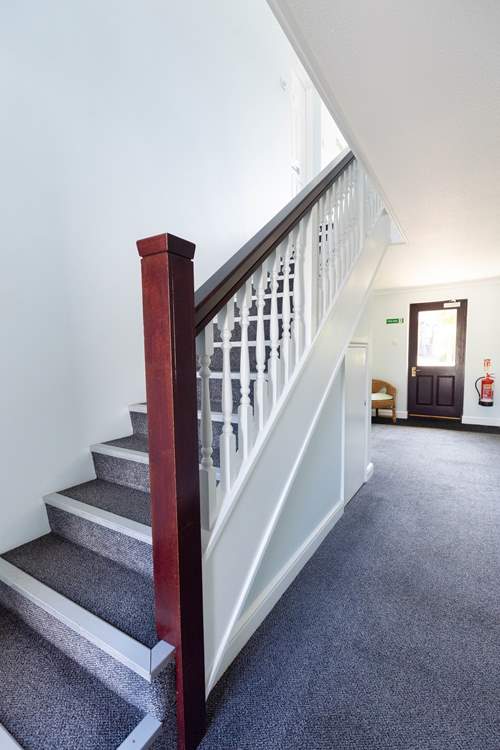 The stairs lead to the first floor where you find The Anchor.