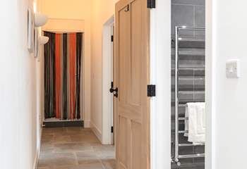 Looking down the hallway towards the bedroom and shower-room on the right.