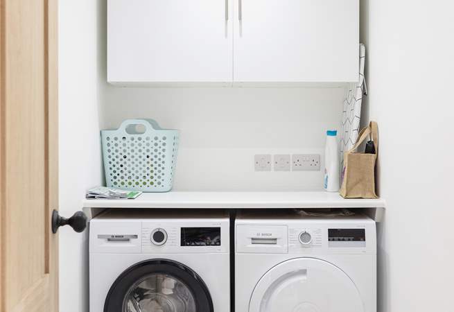 The handy utility-room with washing machine and drier.
