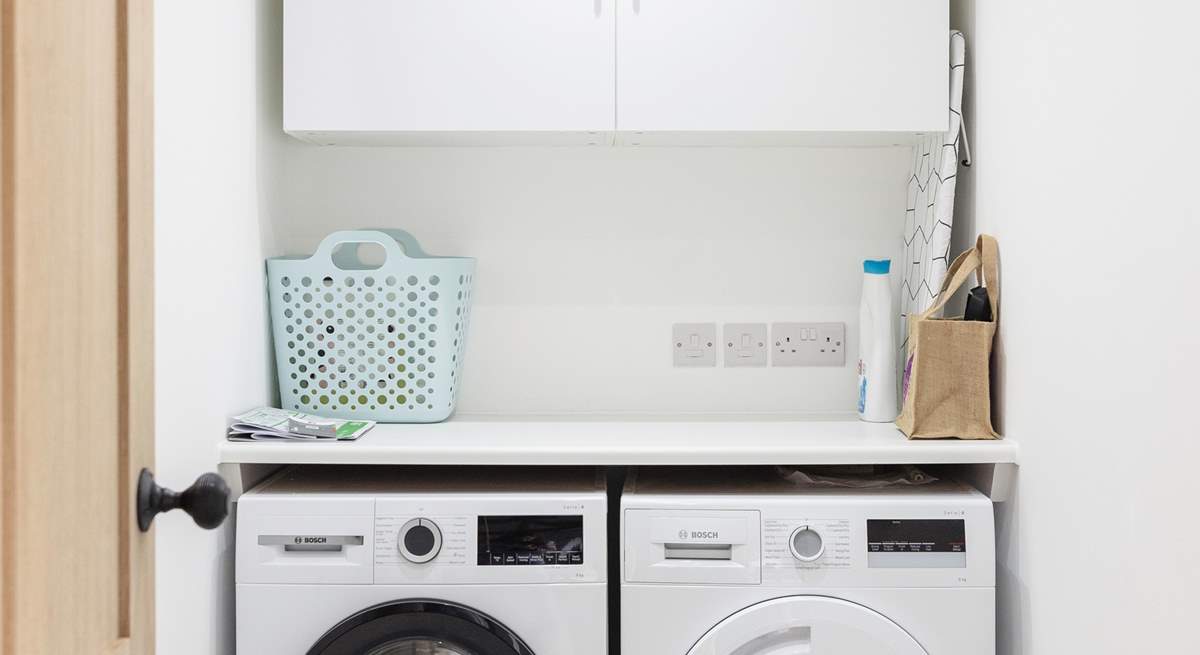 The handy utility-room with washing machine and drier.