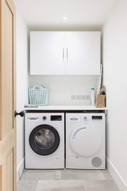 The handy utility-room with washing machine and drier.