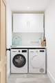 The handy utility-room with washing machine and drier.
