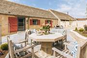 The outdoor dining space for guests staying in Weighbridge End.