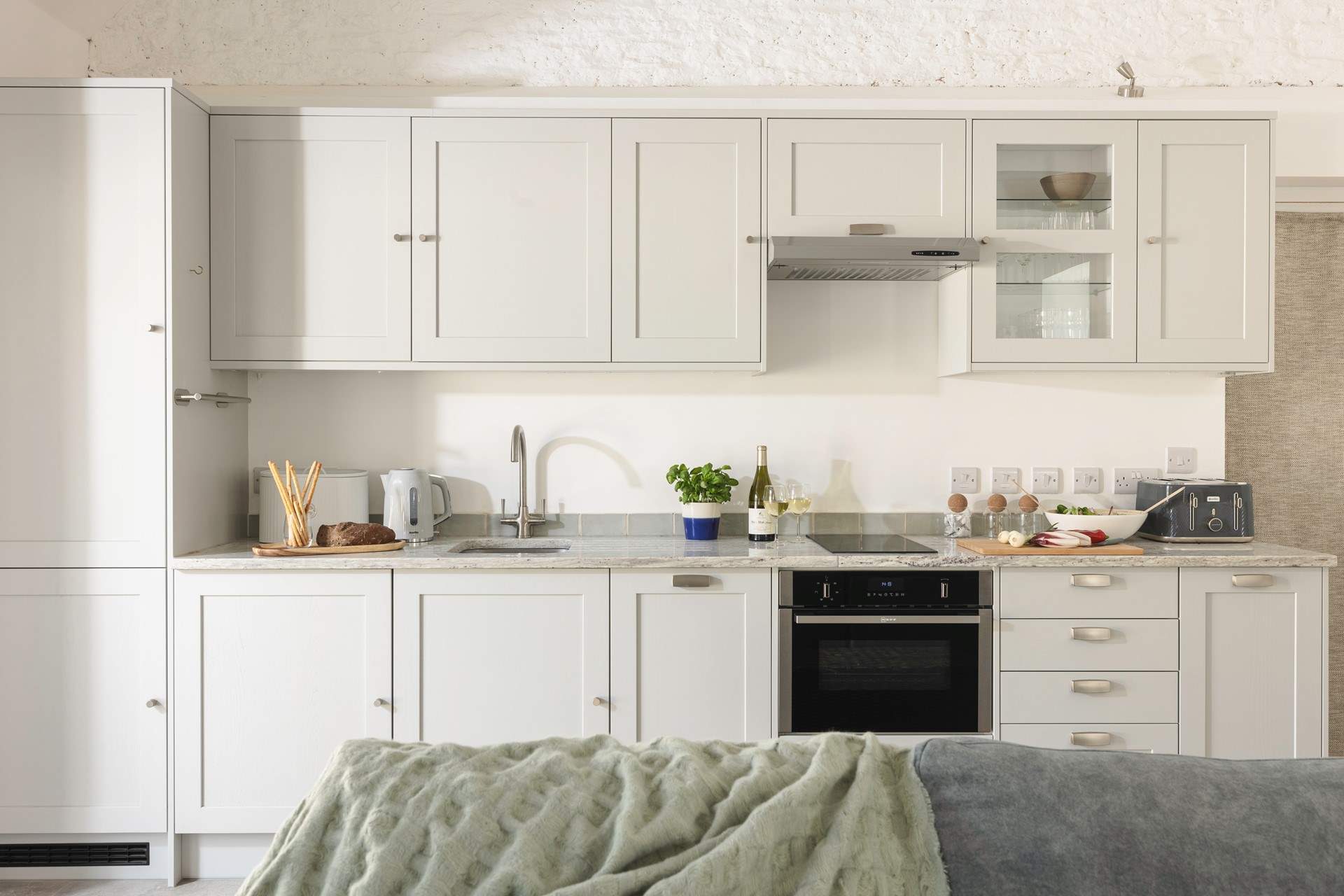 The kitchen is stylish and practical.