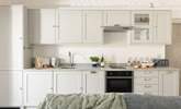 The kitchen is stylish and practical. - Thumbnail Image