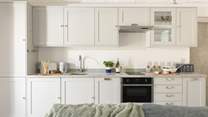The kitchen is stylish and practical.