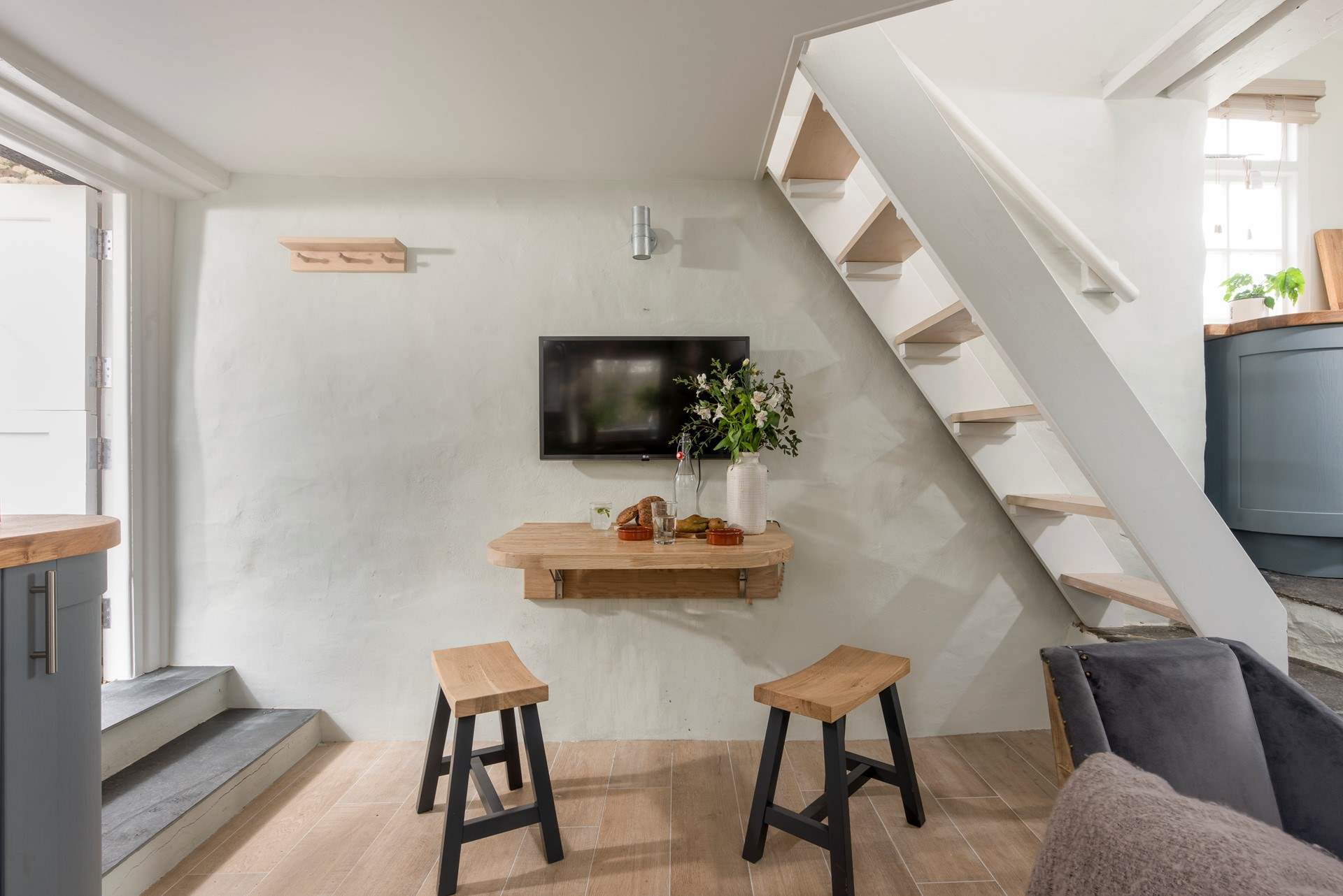 Steps lead down from the front door into the living area.