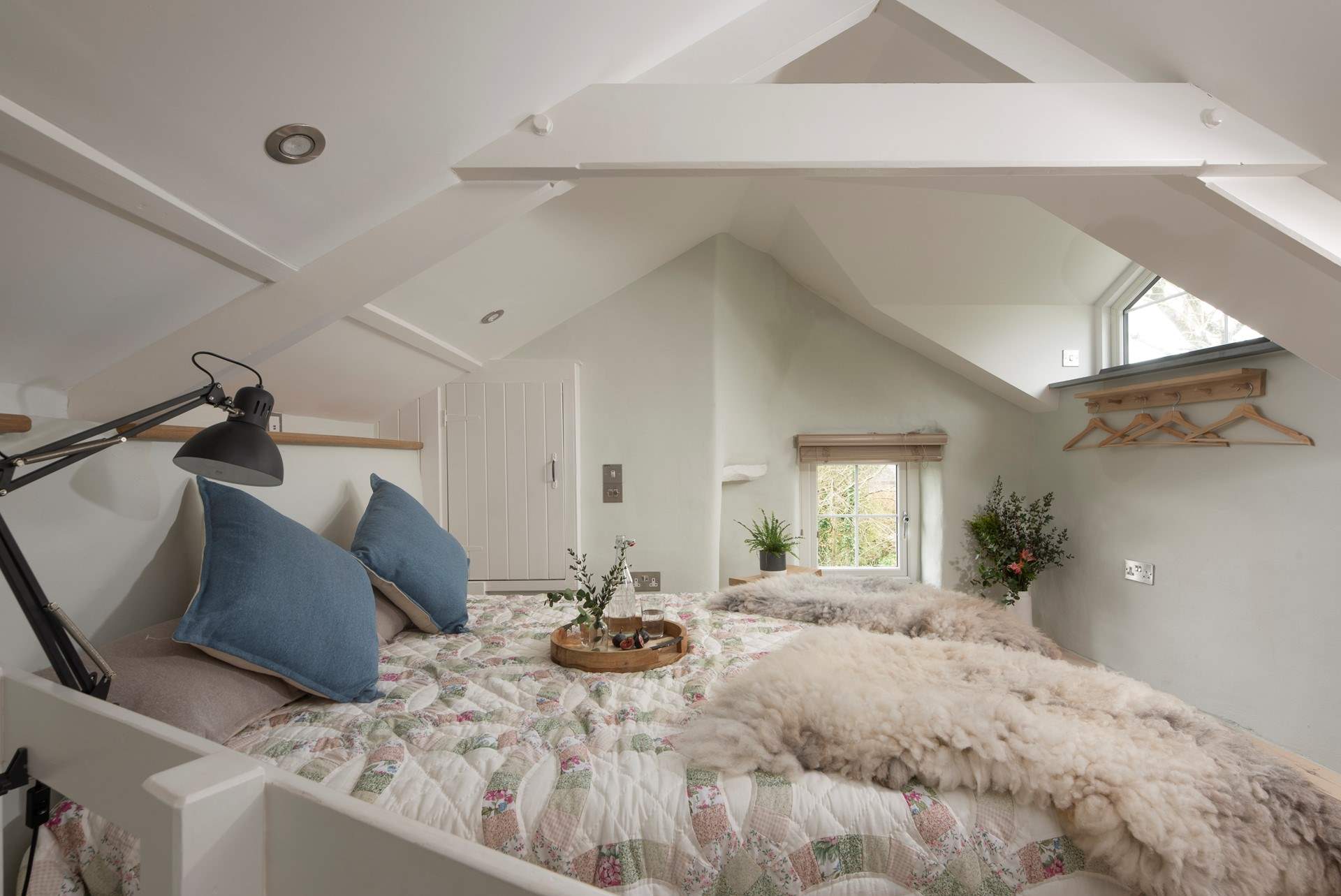 The bedroom is full of charm and character being set under the eaves.