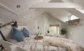 The bedroom is full of charm and character being set under the eaves. - Thumbnail Image