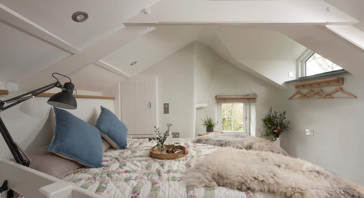 The bedroom is full of charm and character being set under the eaves.