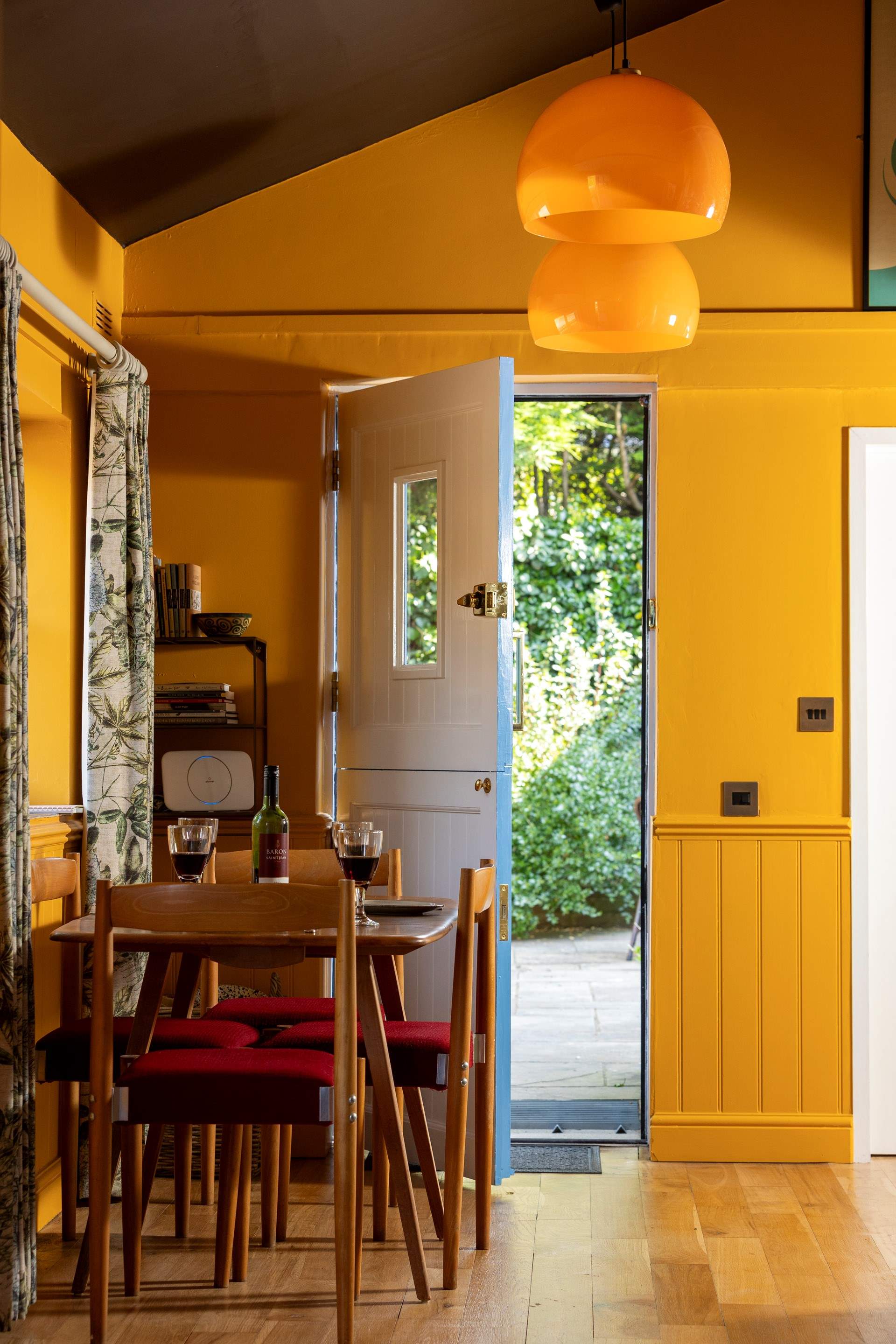 The back door opens into the enclosed courtyard garden.