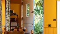 The back door opens into the enclosed courtyard garden.