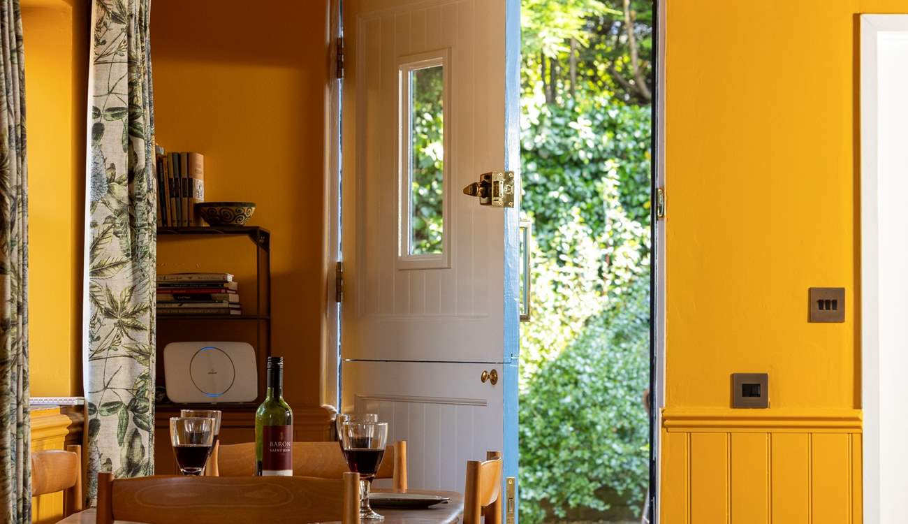 The back door opens into the enclosed courtyard garden.