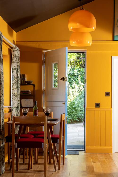 The back door opens into the enclosed courtyard garden.