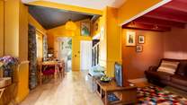 The living area is a welcoming space and lovingly furnished with modern and some nostalgic pieces.