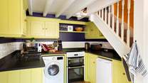 The hand-crafted kitchen is well-equipped with all mod-cons and high quality cookware that any chef would be proud of.