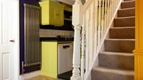 Stairs lead to the double bedroom and bathroom.