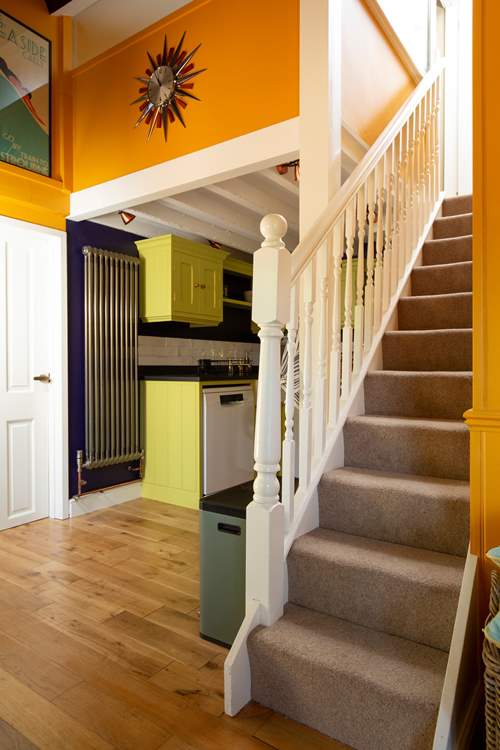 Stairs lead to the double bedroom and bathroom.