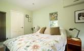 The ground floor bedroom is a peaceful retreat. - Thumbnail Image