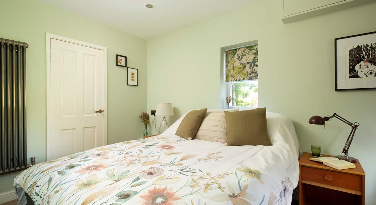 The ground floor bedroom is a peaceful retreat.