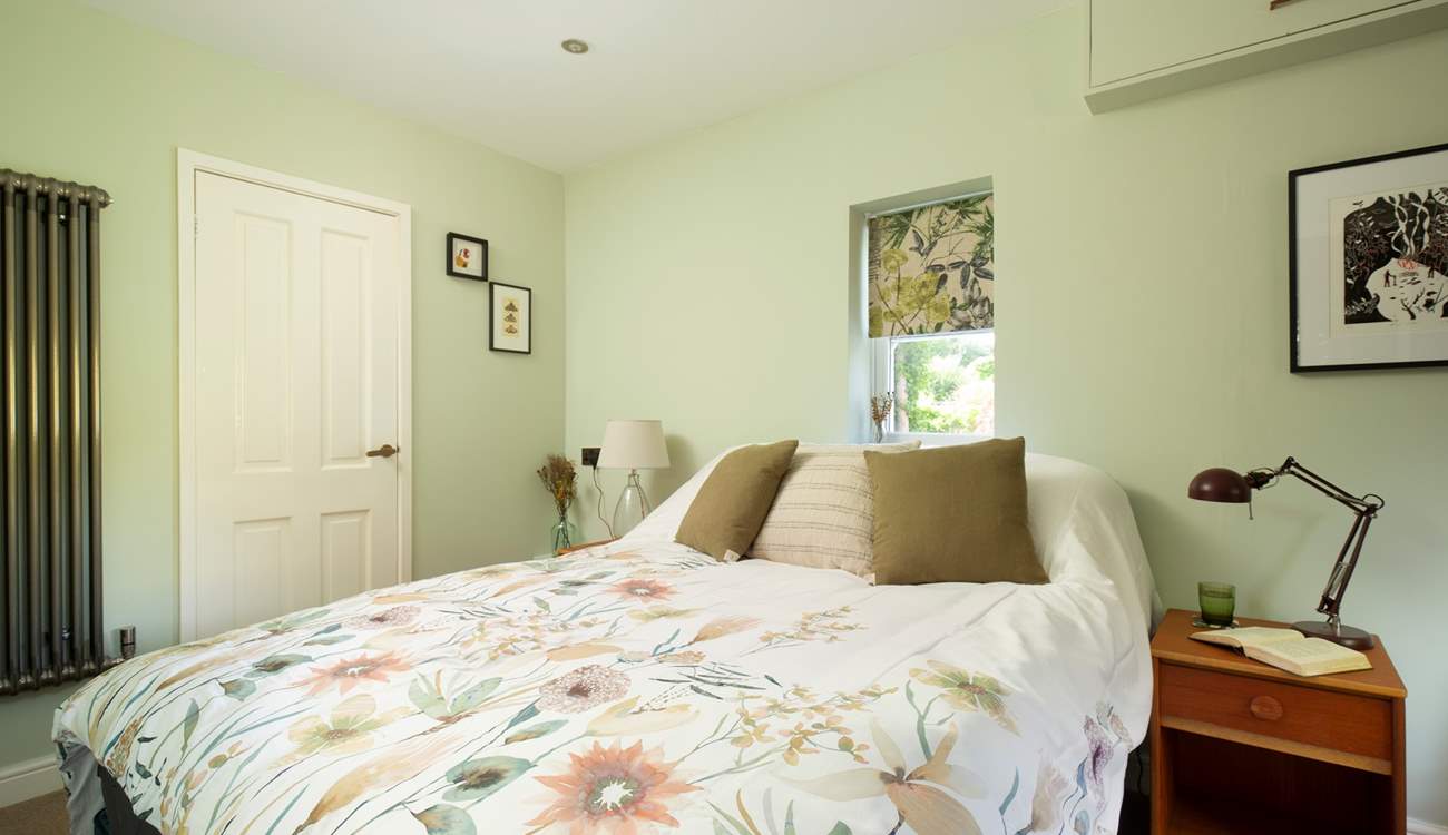 The ground floor bedroom is a peaceful retreat.