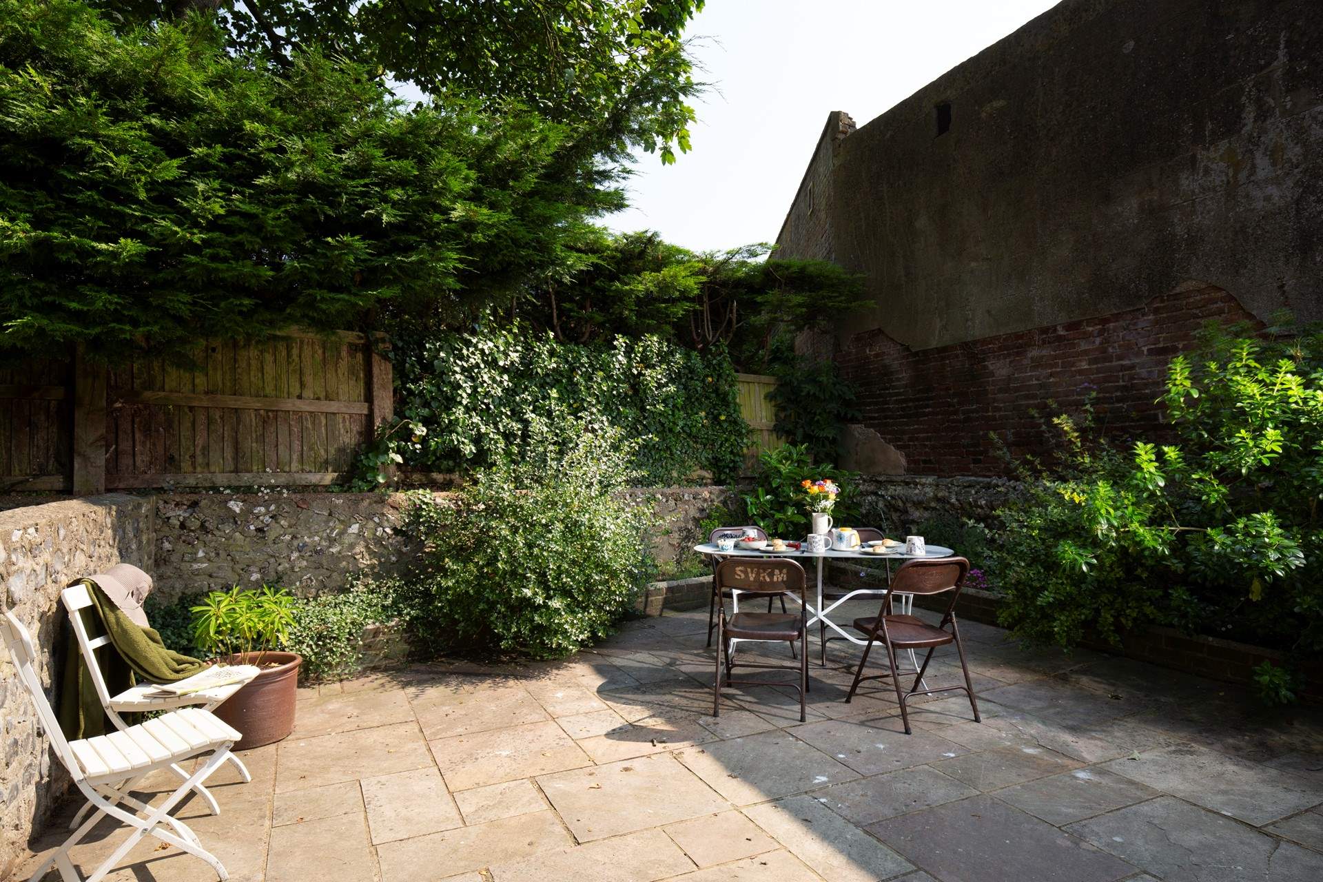 Listen to birdsong in the pretty courtyard garden.