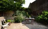 Listen to birdsong in the pretty courtyard garden. - Thumbnail Image