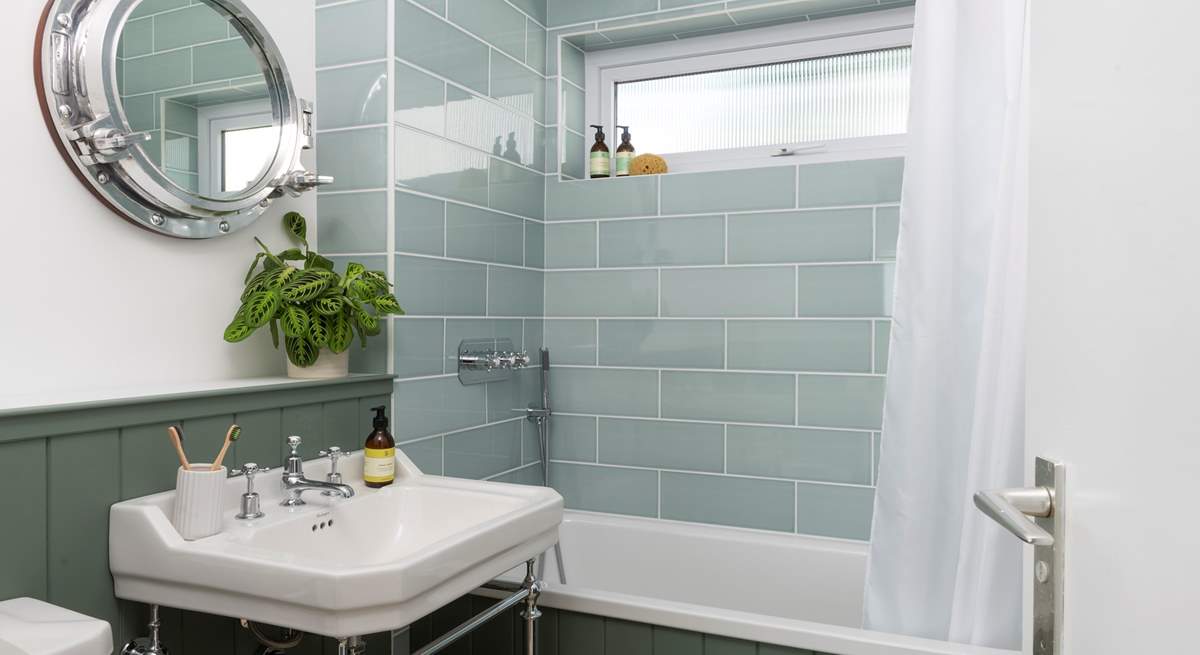 One of the beautifully styled bathrooms with overhead shower.