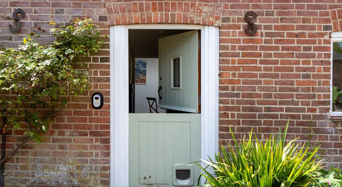 The stable-door leads to the entrance hall.