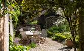 This pretty garden offers entertaining areas and quiet corners. 
  - Thumbnail Image