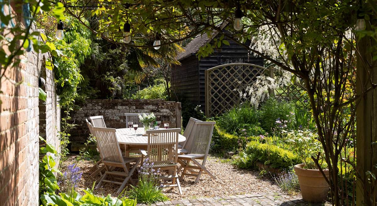 This pretty garden offers entertaining areas and quiet corners. 
 