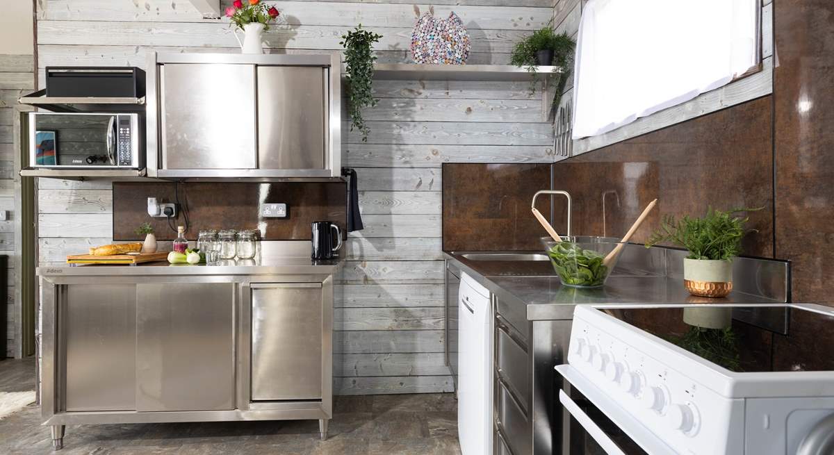 The industrial style kitchen is beautifully appointed with everything you need to fuel your beach days.