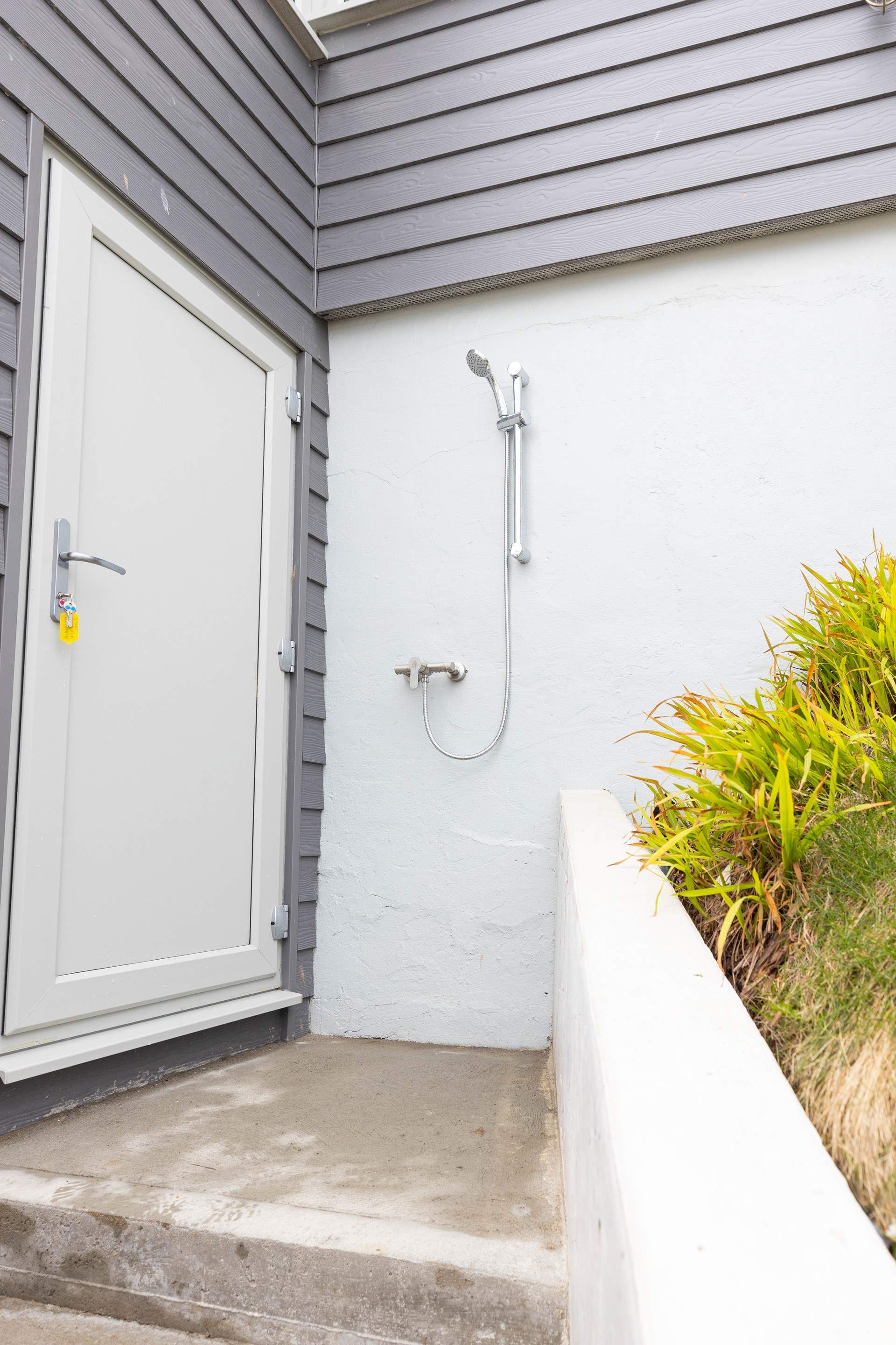 A handy external shower for sandy toes or paws.