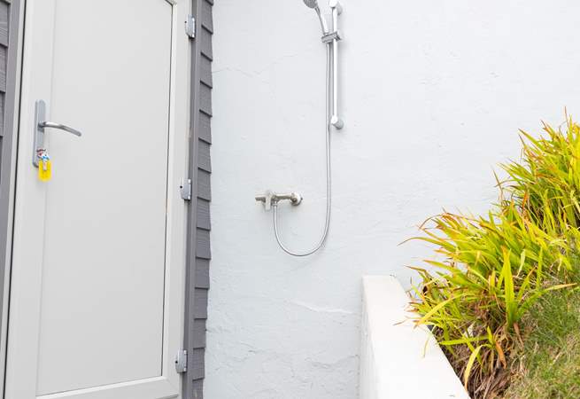 A handy external shower for sandy toes or paws.