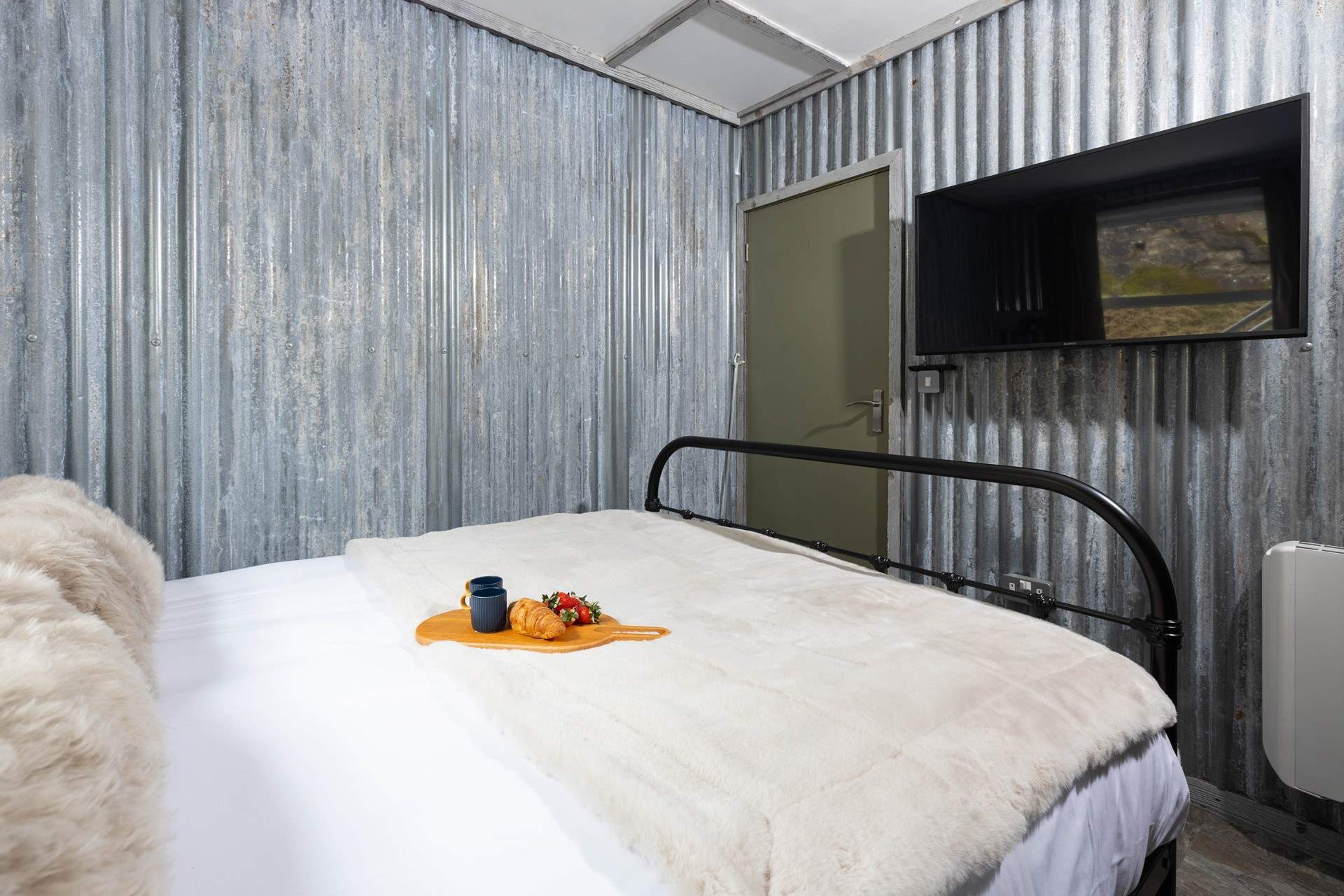 Not quite enough room for bedside tables here, but perfectly appointed to rest your head after a day of activities.