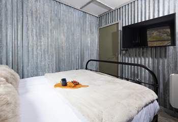Not quite enough room for bedside tables here, but perfectly appointed to rest your head after a day of activities.