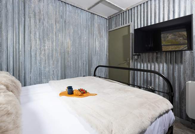 Not quite enough room for bedside tables here, but perfectly appointed to rest your head after a day of activities.