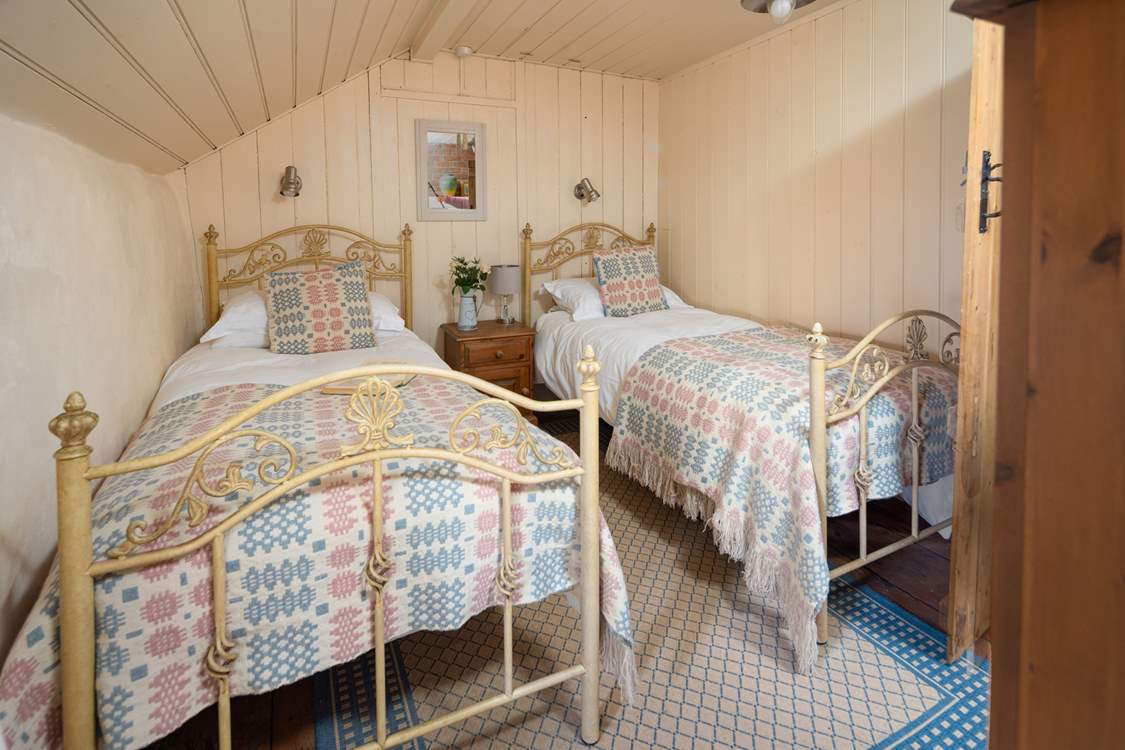 The sweetest twin room with luxurious Welsh wool furnishings.