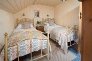 The sweetest twin room with luxurious Welsh wool furnishings.