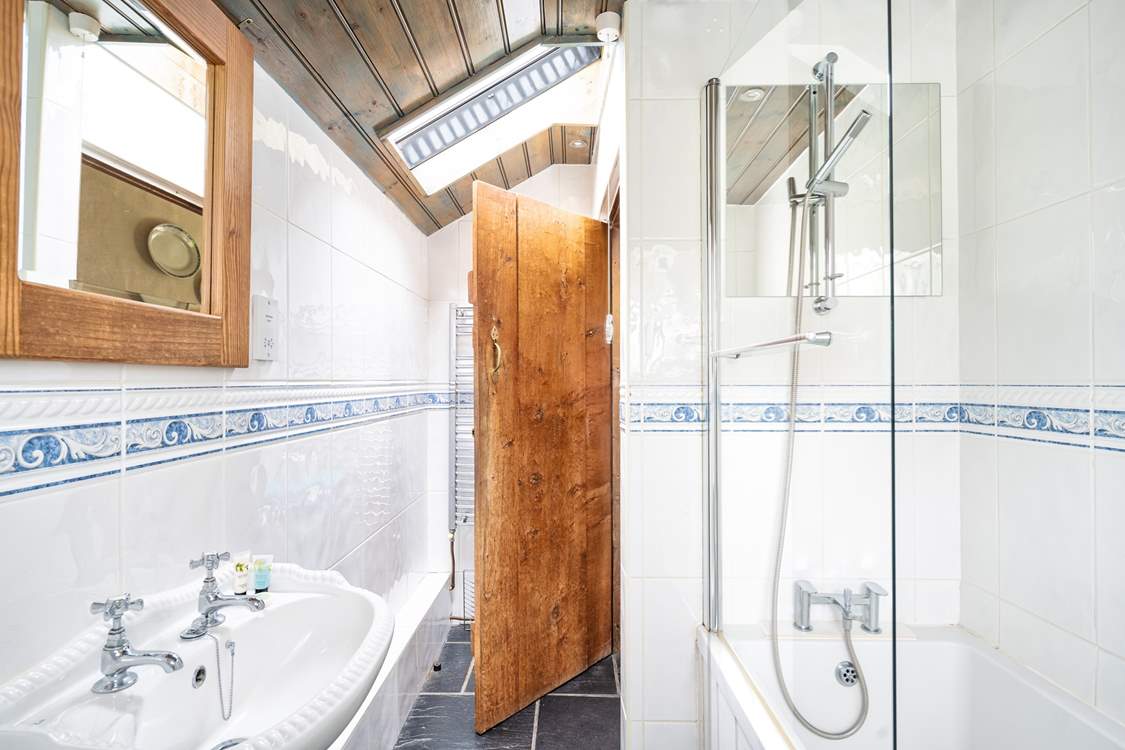 The light and airy bathroom is on the ground floor.