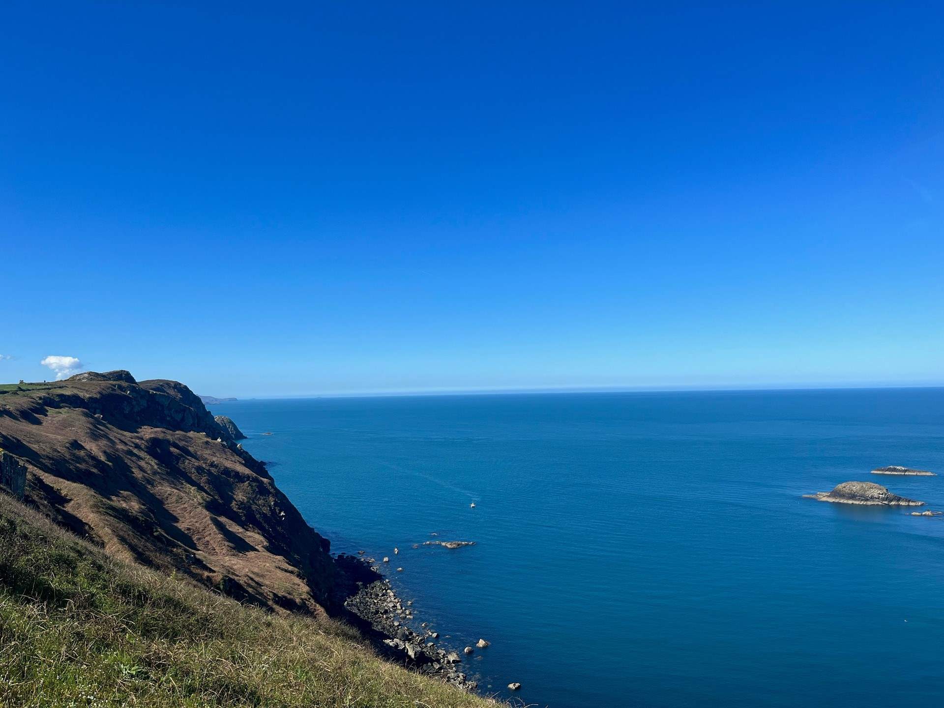 Crystal blue sea and dramatic cliffs of Strumble Head