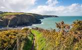 Follow the coastal path to discover craggy coves, sandy beaches and pretty seaside villages.  - Thumbnail Image