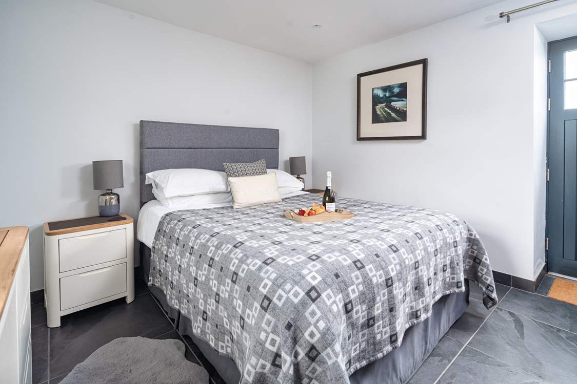 Enter via the stylish ground floor bedroom or via the steps on the side which lead up to the kitchen.