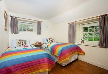 The sweet twin bedroom is tucked away at the back of the cottage. 