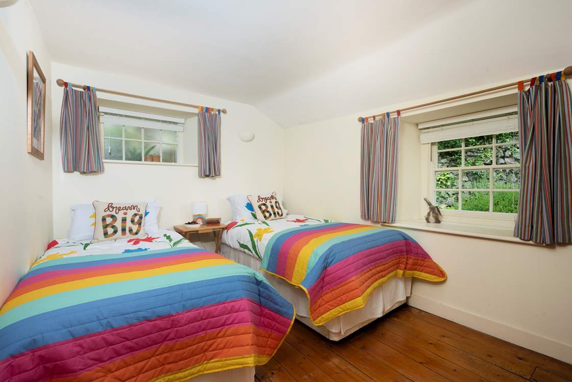 The sweet twin bedroom is tucked away at the back of the cottage.