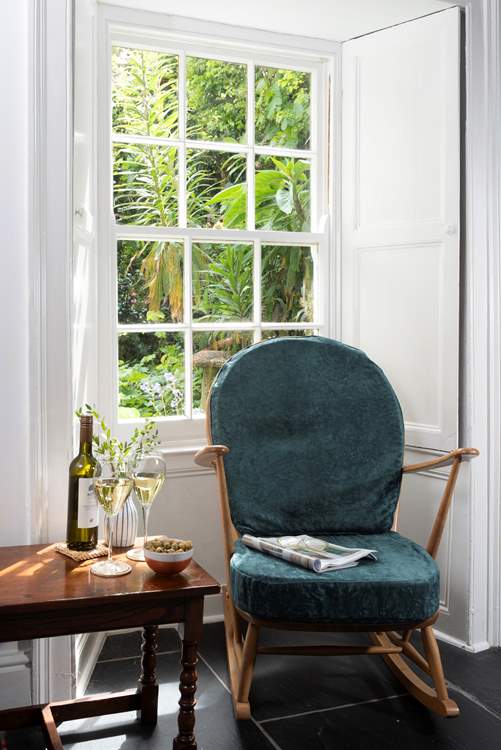 Take a perch in the window and look out over the pretty front garden.