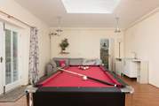 The games-room is separate from the house and has a pool table which turns into a table tennis table - fun for everyone.